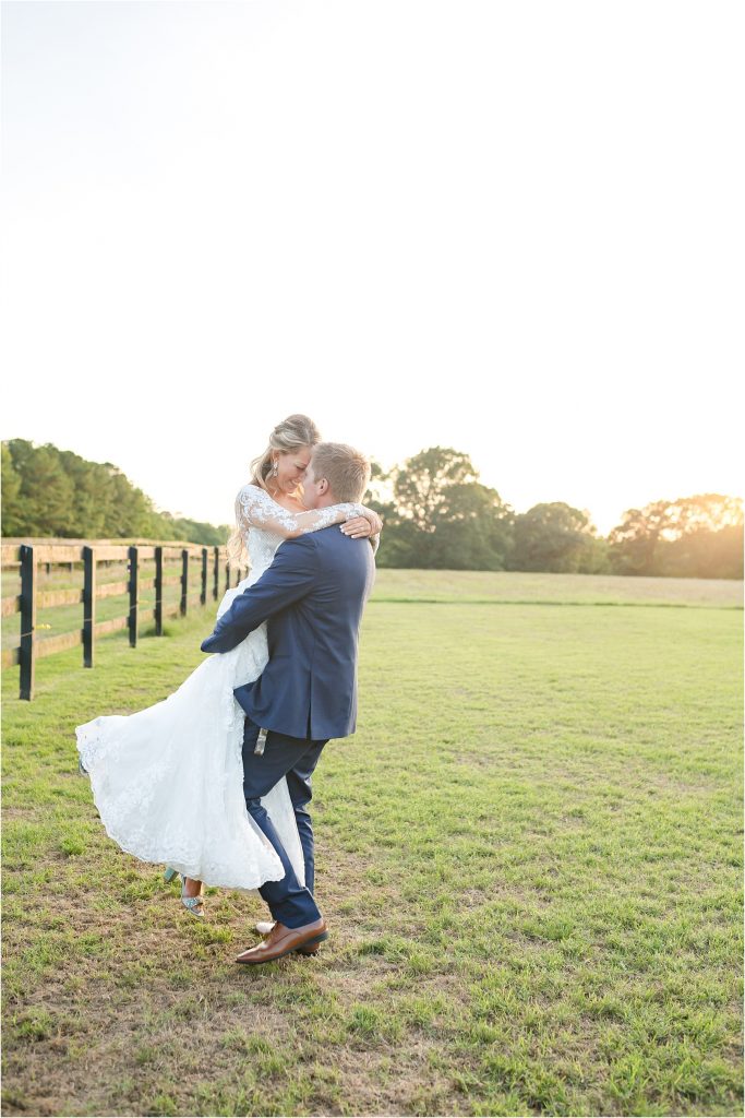 bride and groom spinning in field little herb house